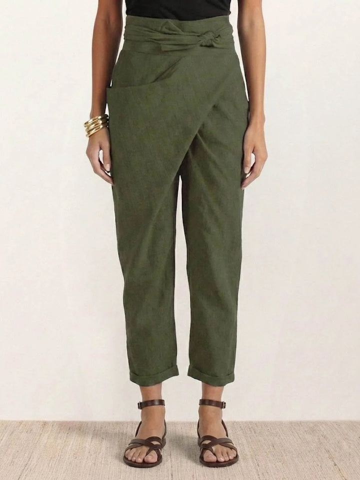 Army green wrap front tapered pants on model, full-length view