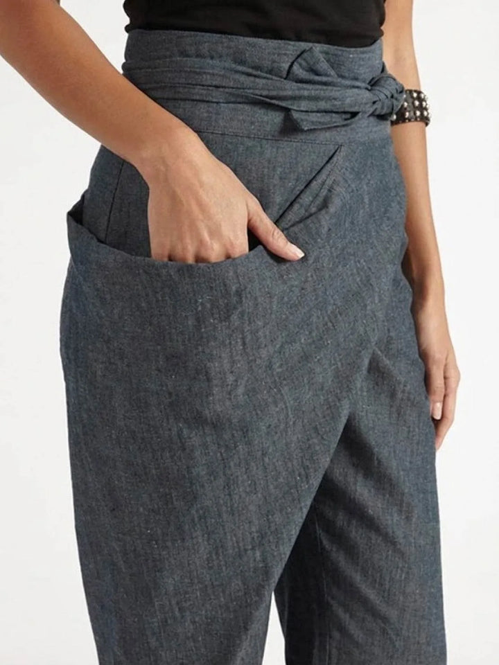 Close-up detail of gray wrap front closure and tapered leg