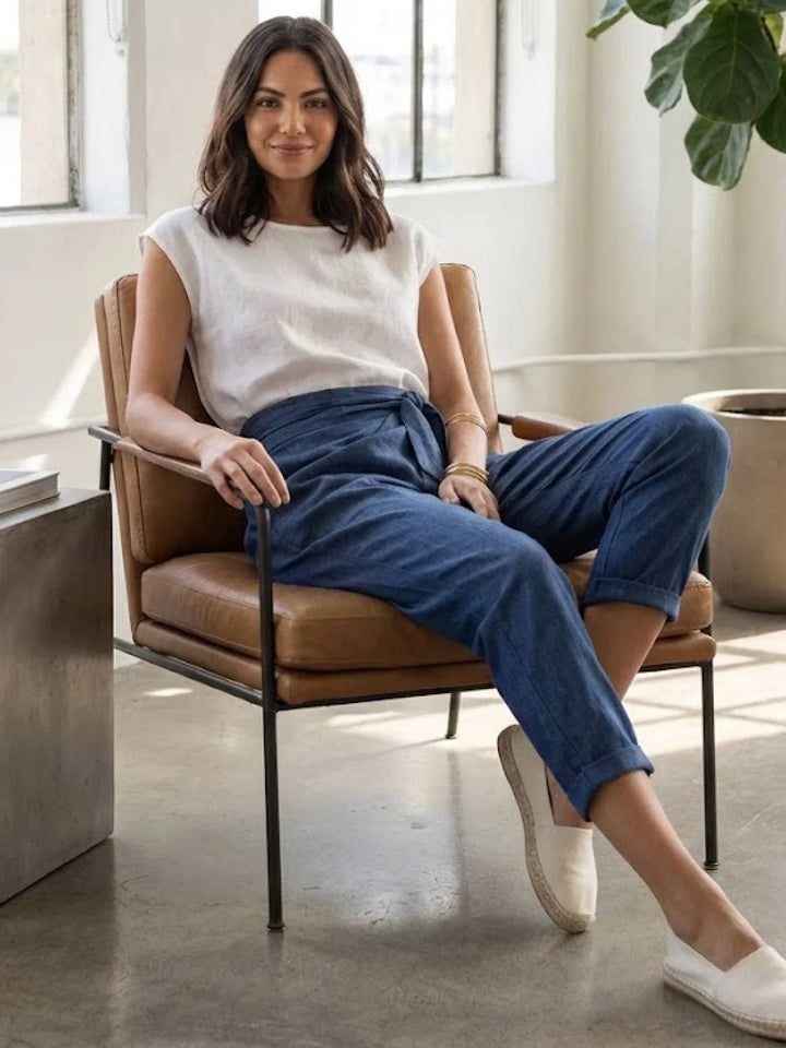 Gray wrap front tapered pants on model, full-length styled view