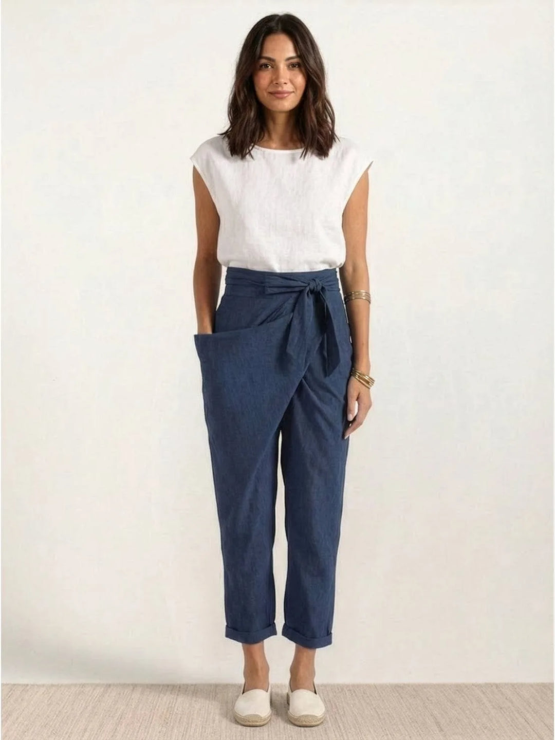 Gray wrap front tapered pants on model, relaxed standing pose