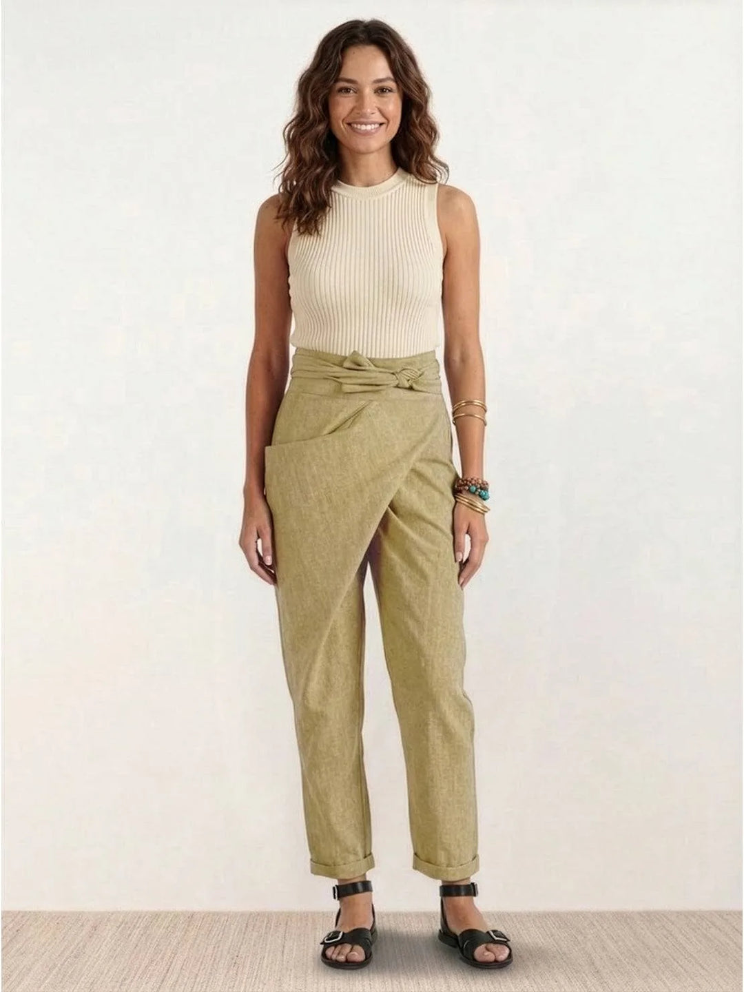 Gray wrap front tapered pants on model, full-length alternate pose