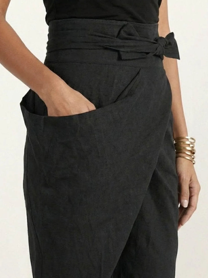 Gray wrap front tapered pants on model, full-length standing view