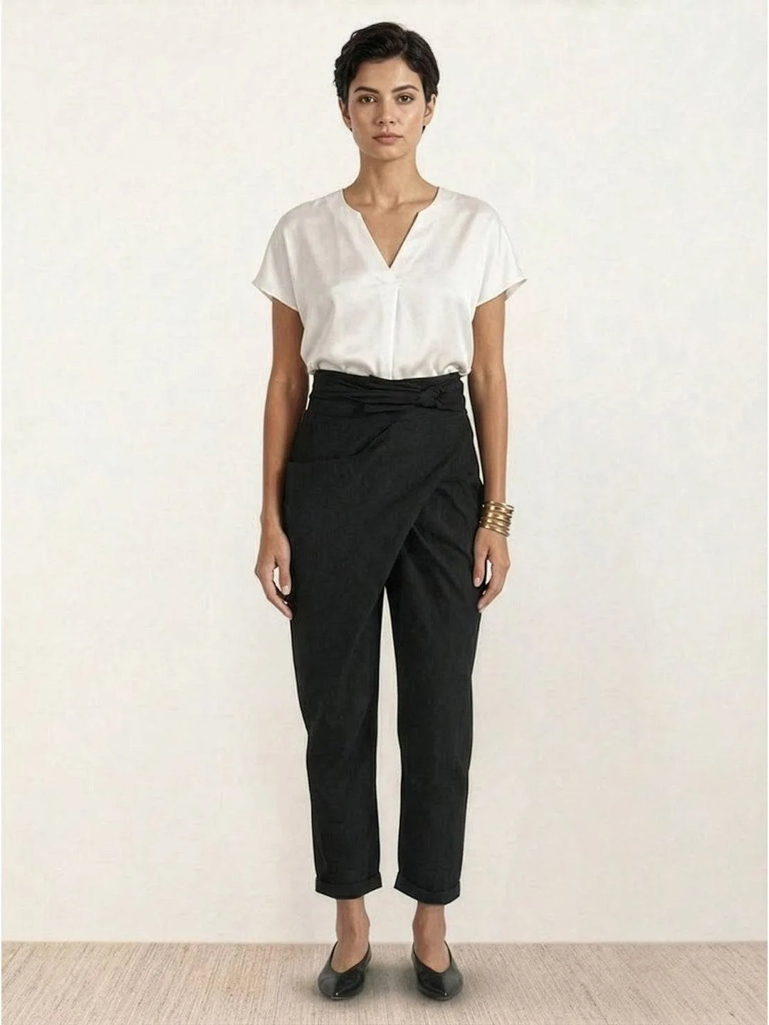 Gray wrap front tapered pants on model, final full-length view