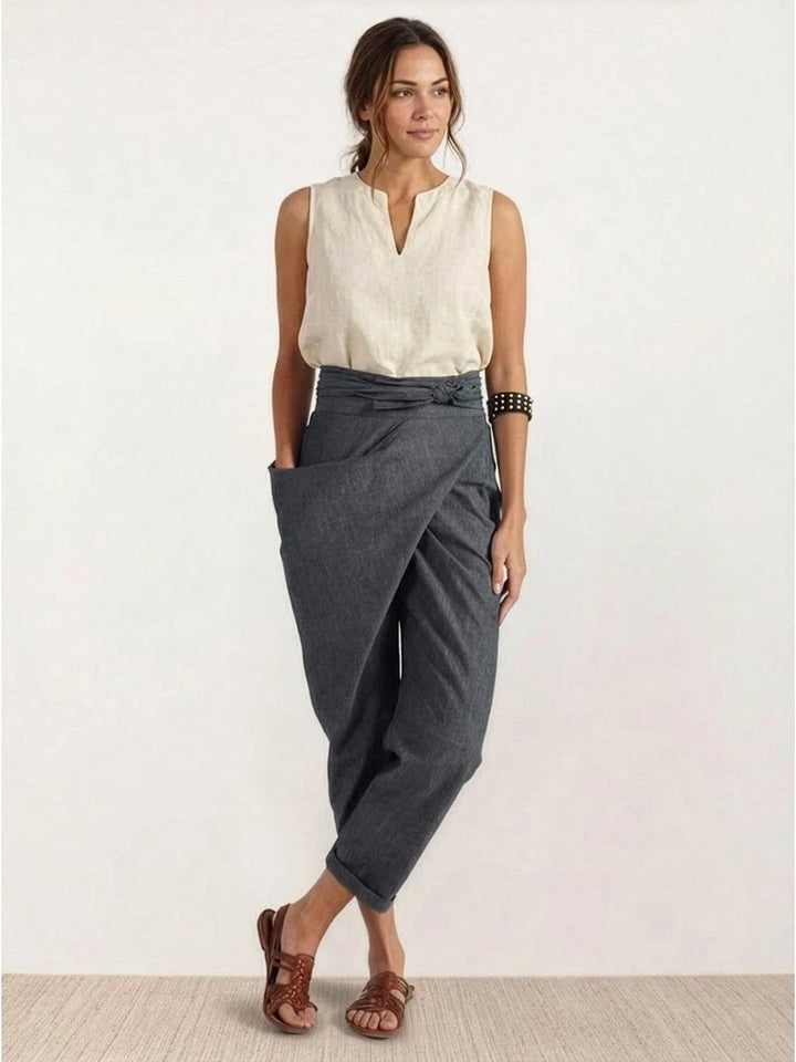Gray wrap front tapered pants on model, styled full-length view