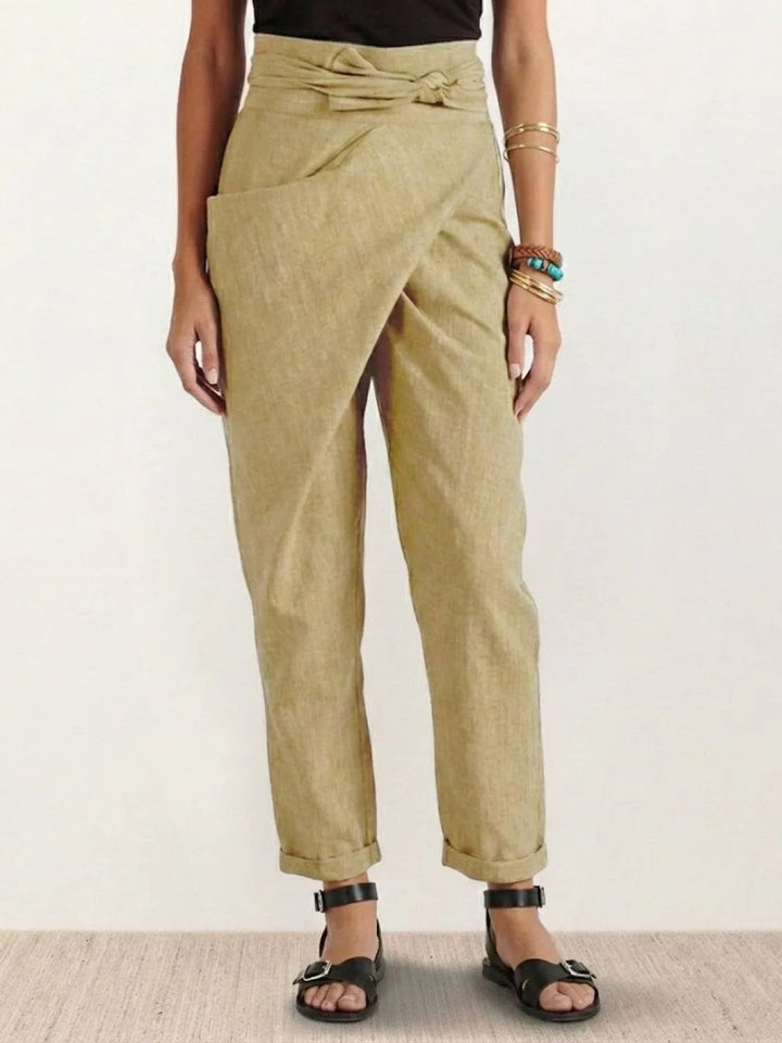 Khaki wrap front tapered pants on model, full-length view