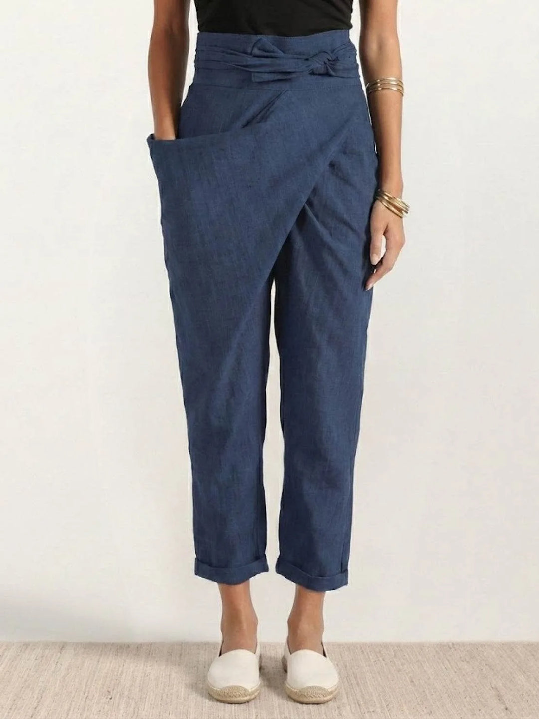 Navy blue wrap front tapered pants on model, full-length view
