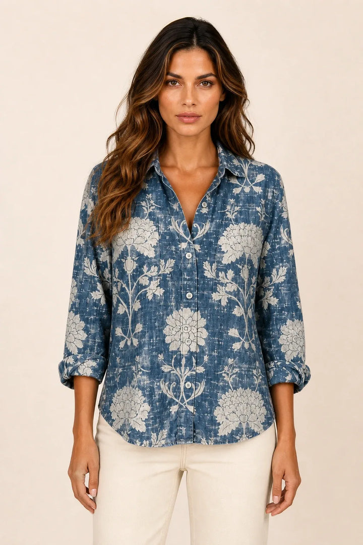Blue bandana print button-down blouse on model in contrapposto stance