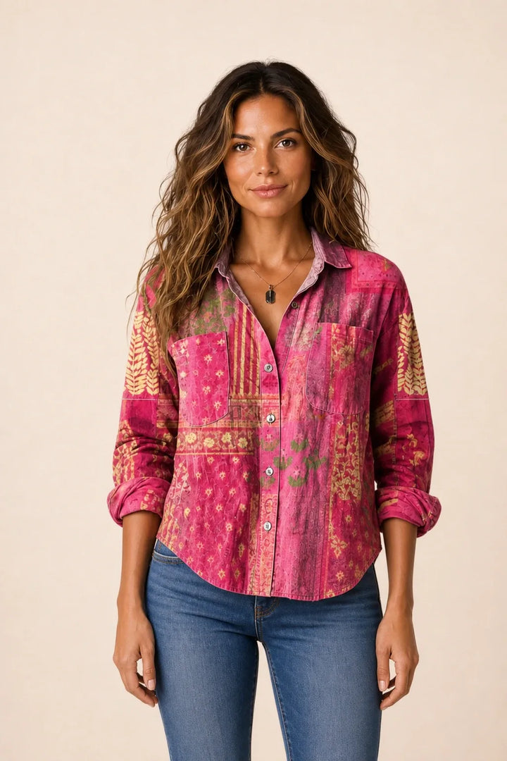 Pink bandana print button-down blouse on model in contrapposto stance