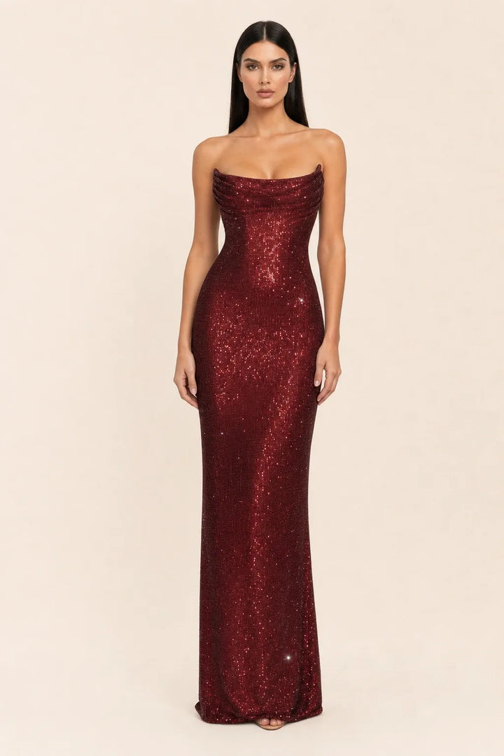 Burgundy crystal cowl gown on model in contrapposto stance, draped cowl neckline and floor-length fit