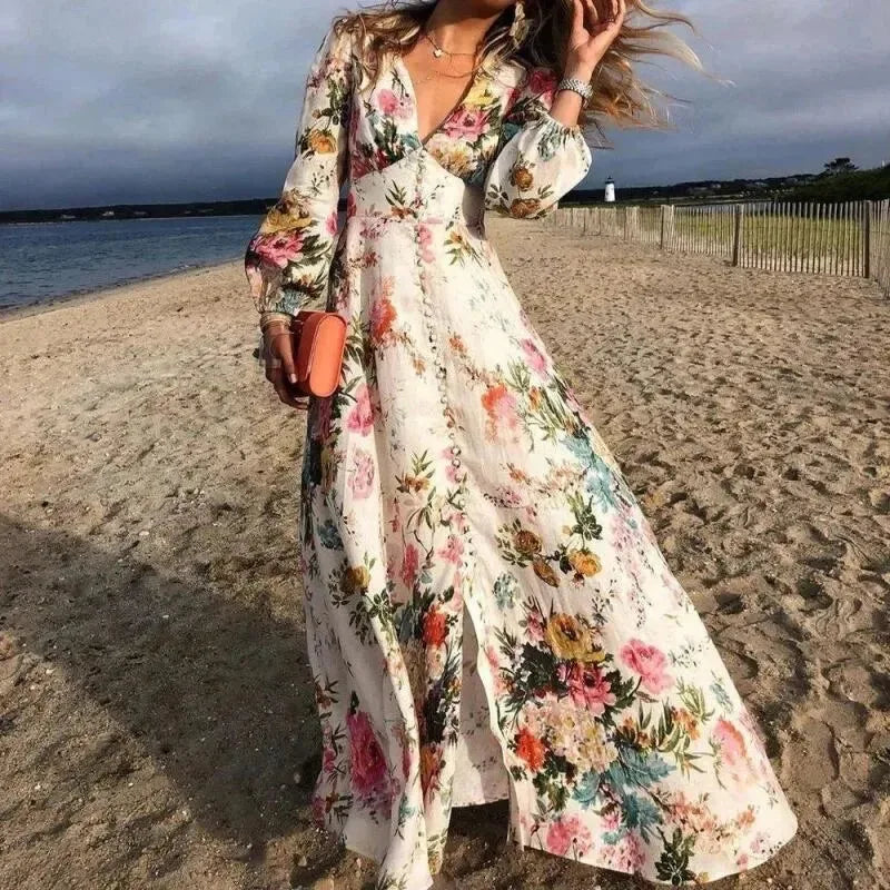 Woman wearing a floral maxi dress, standing in a front-facing pose