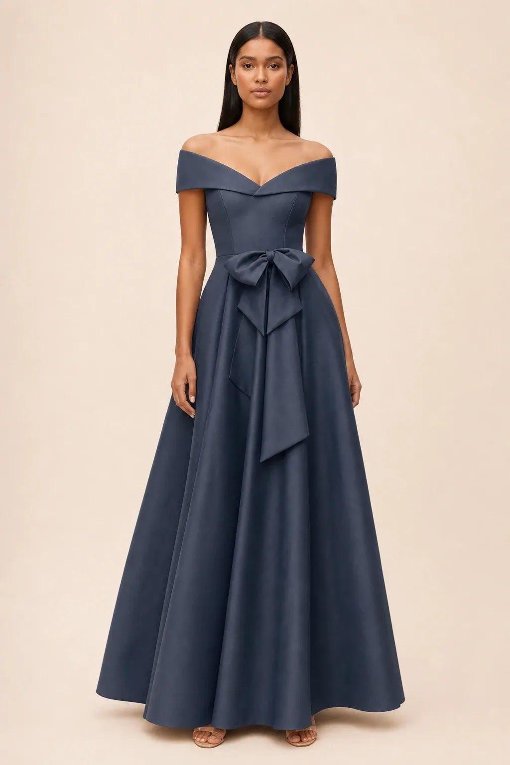 Dark navy off-shoulder midi dress with bow detail, model in contrapposto stance