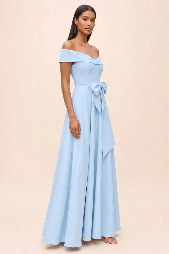 Light blue off-shoulder bow midi dress, model in three-quarter turn