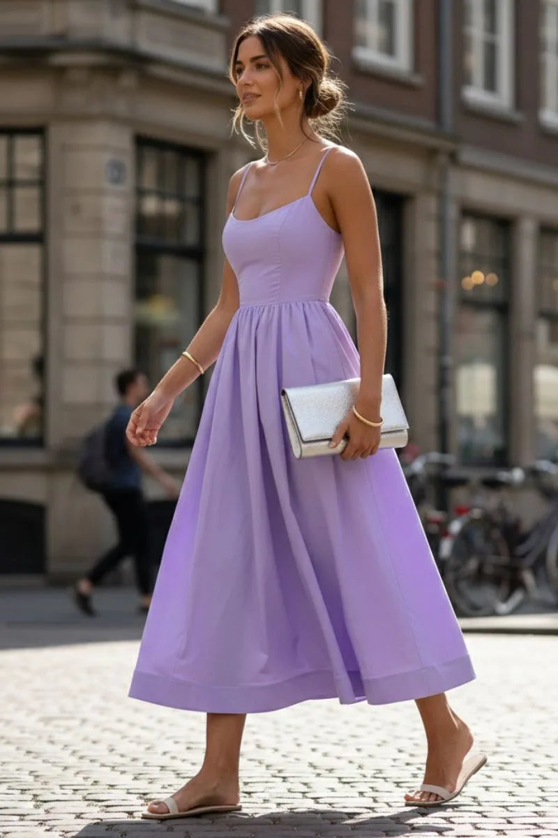 Purple fit and flare midi dress on model, side view