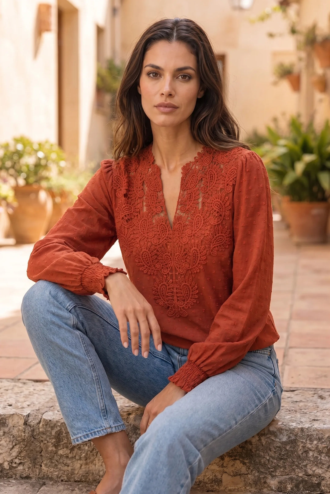 Model wearing red lace panel blouse in second lifestyle setting