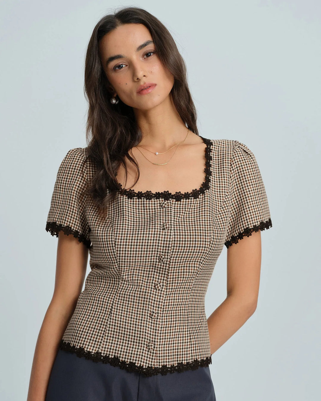 Brown gingham lace-trim top styled on model, alternate view