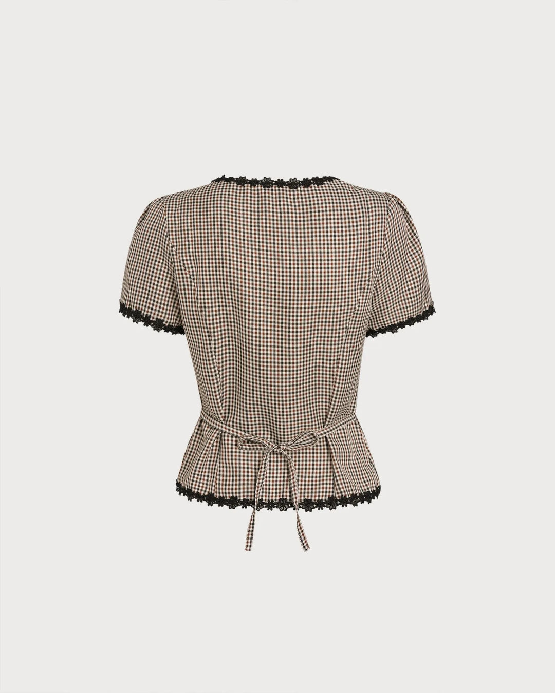 Brown gingham lace-trim top on model, relaxed standing pose
