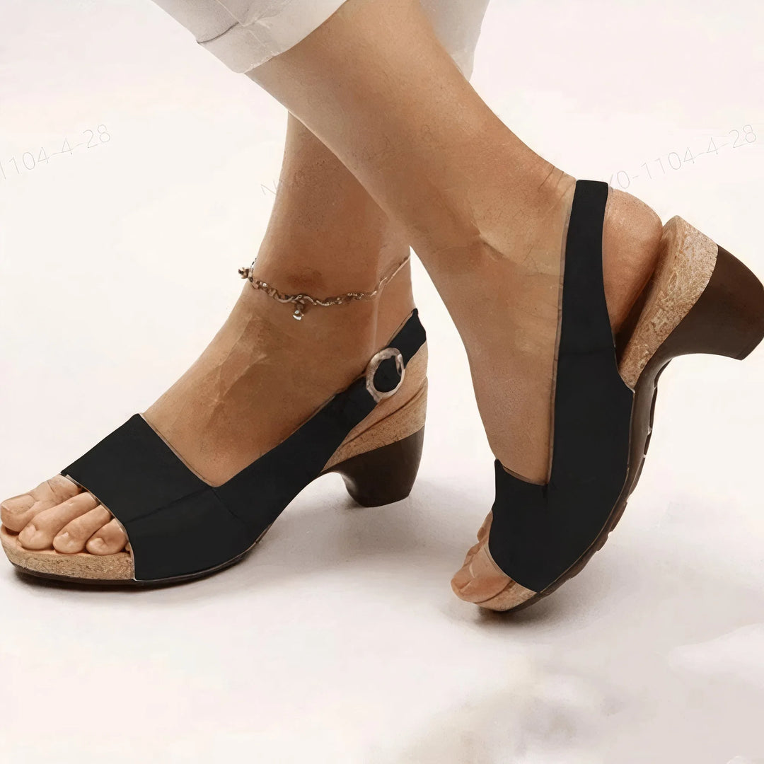 Black block heel slingback sandal, front view showing open toe and ankle strap