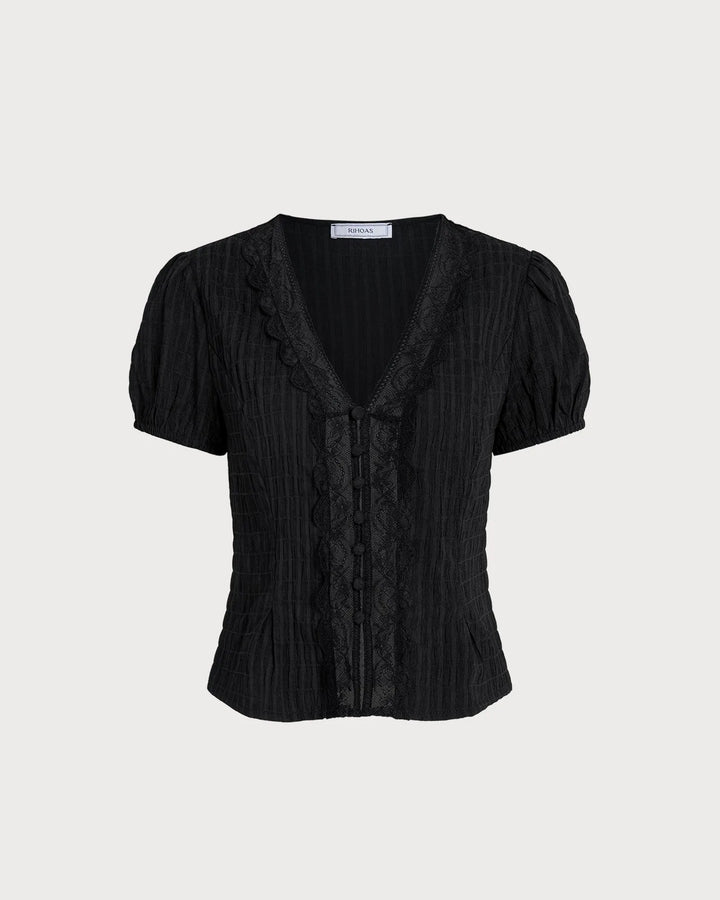 Black lace trim puff sleeve blouse, model in additional pose