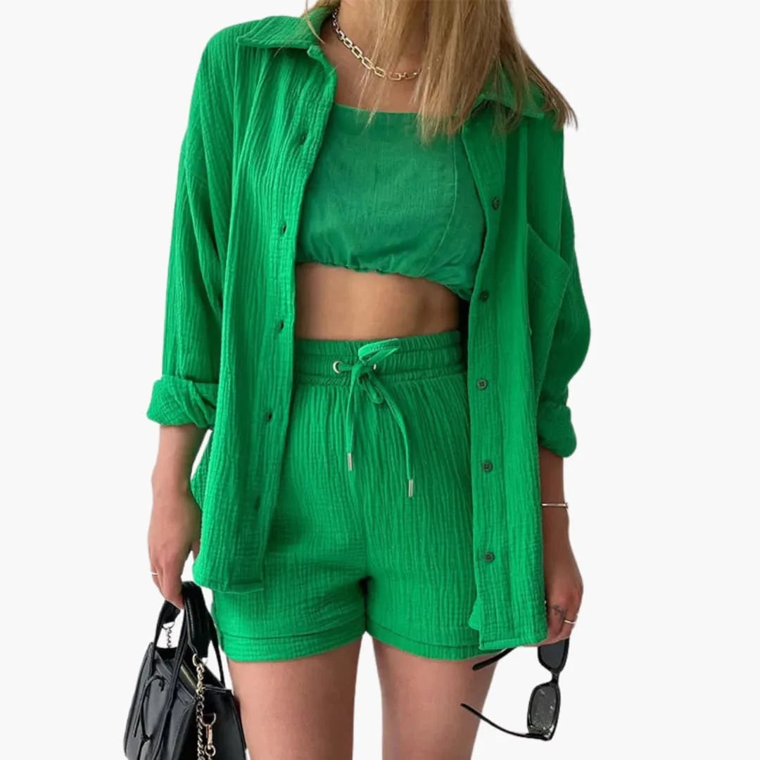 Model wearing a vegetable green crinkle button-up shirt and matching shorts set