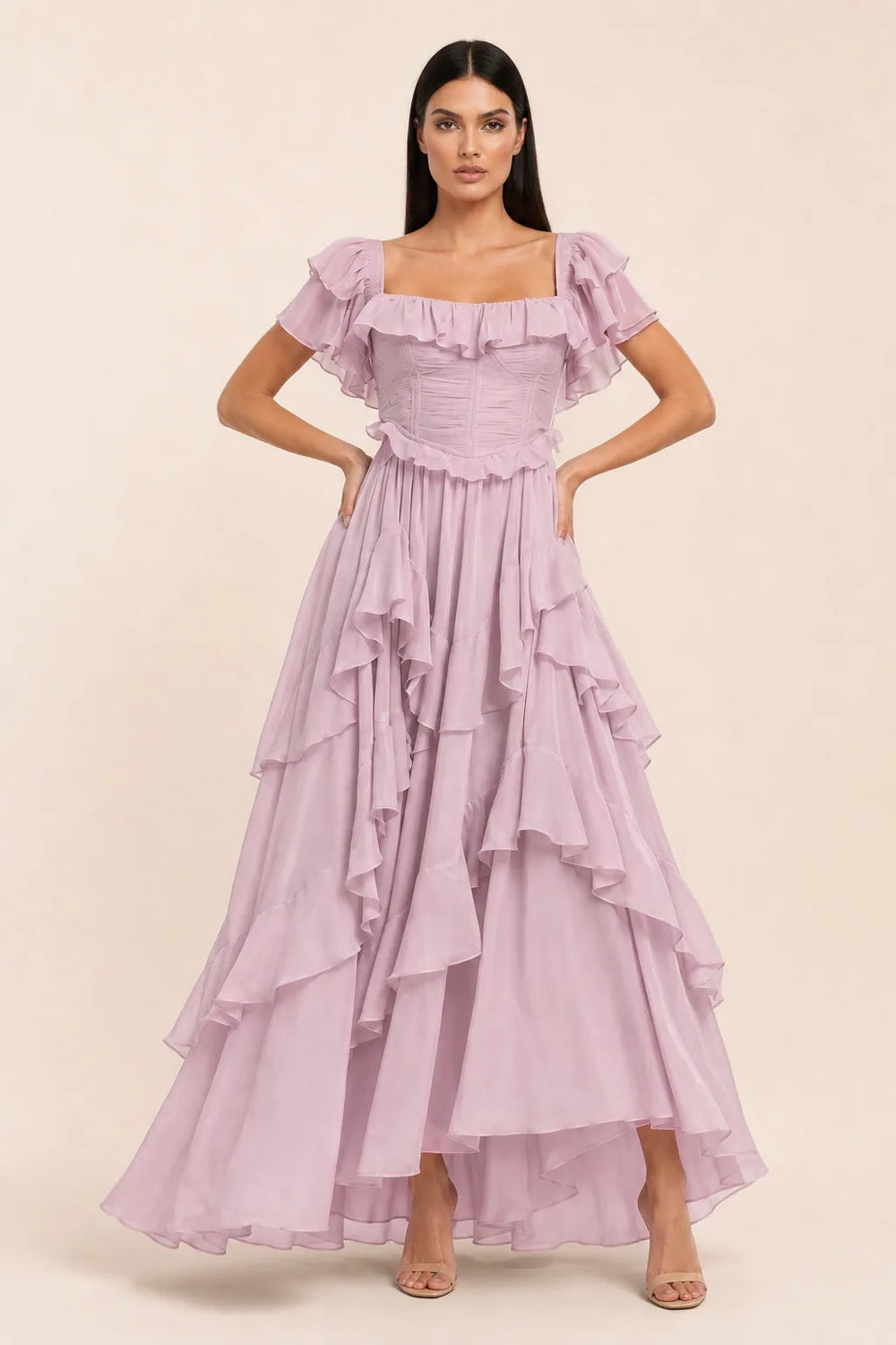 Pink ruffle corset midi dress on model in contrapposto stance