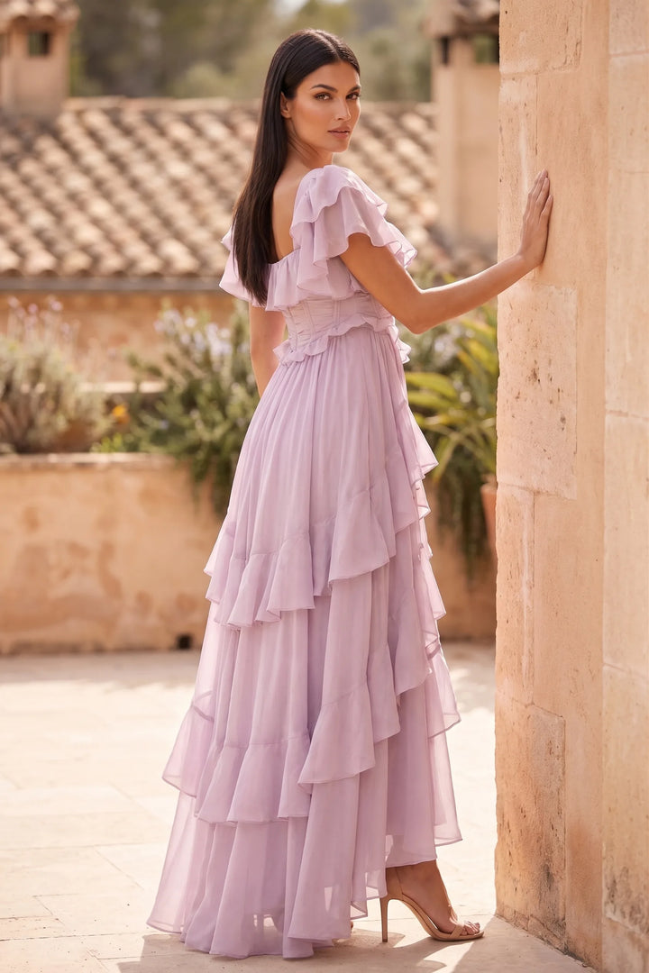 Model wearing pink ruffle corset midi dress in lifestyle setting