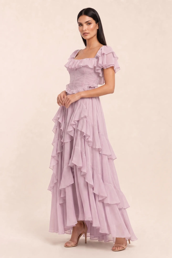 Pink ruffle corset midi dress on model in three-quarter turn