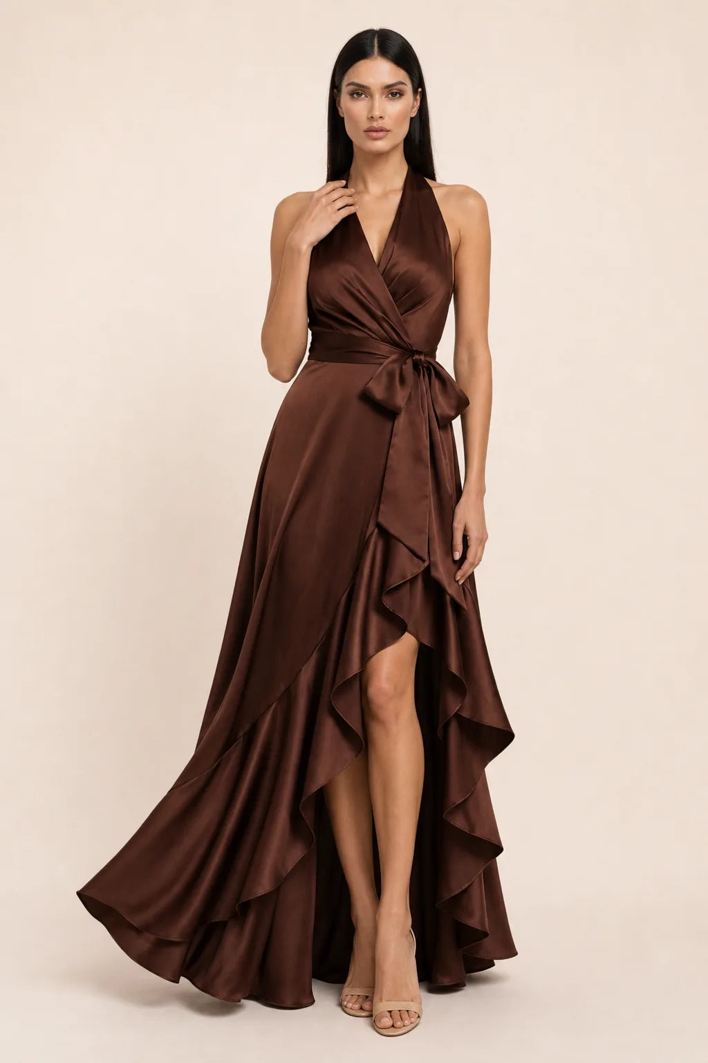 Brown satin halter wrap gown on model in contrapposto stance