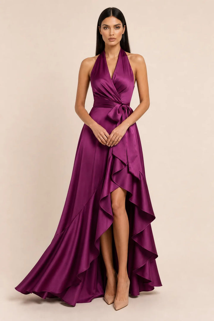 Fuchsia satin halter wrap gown on model in contrapposto stance