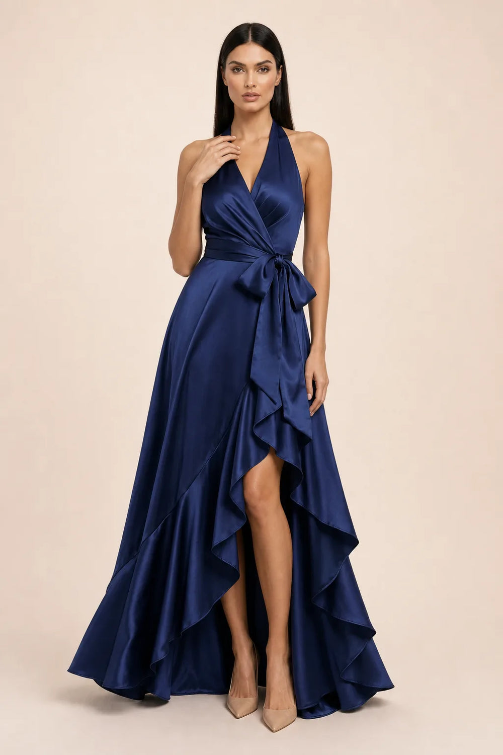 Navy blue satin halter wrap gown on model in contrapposto stance