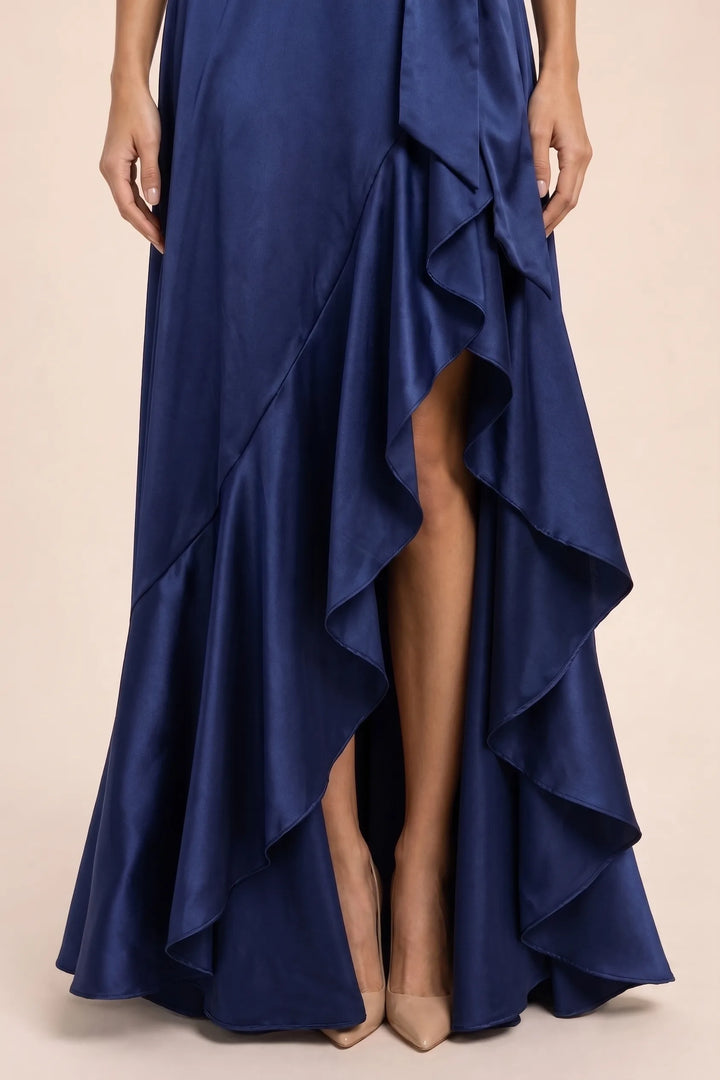 Close-up detail of navy blue satin halter wrap gown neckline and wrap bodice