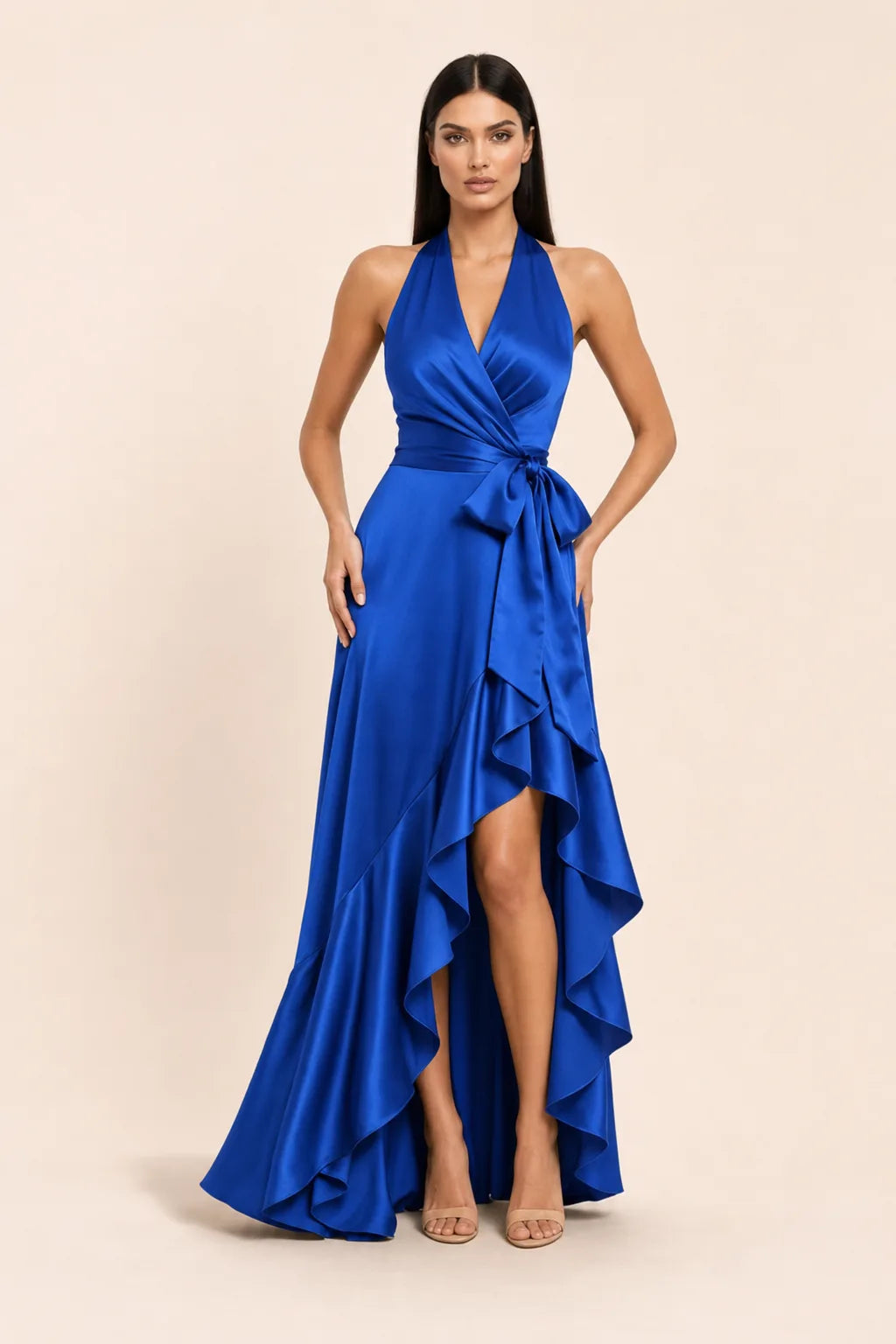 Royal blue satin halter wrap gown on model in contrapposto stance