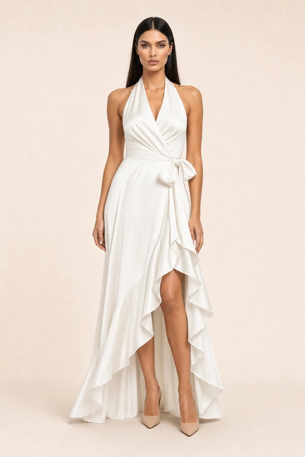 White satin halter wrap gown on model in contrapposto stance