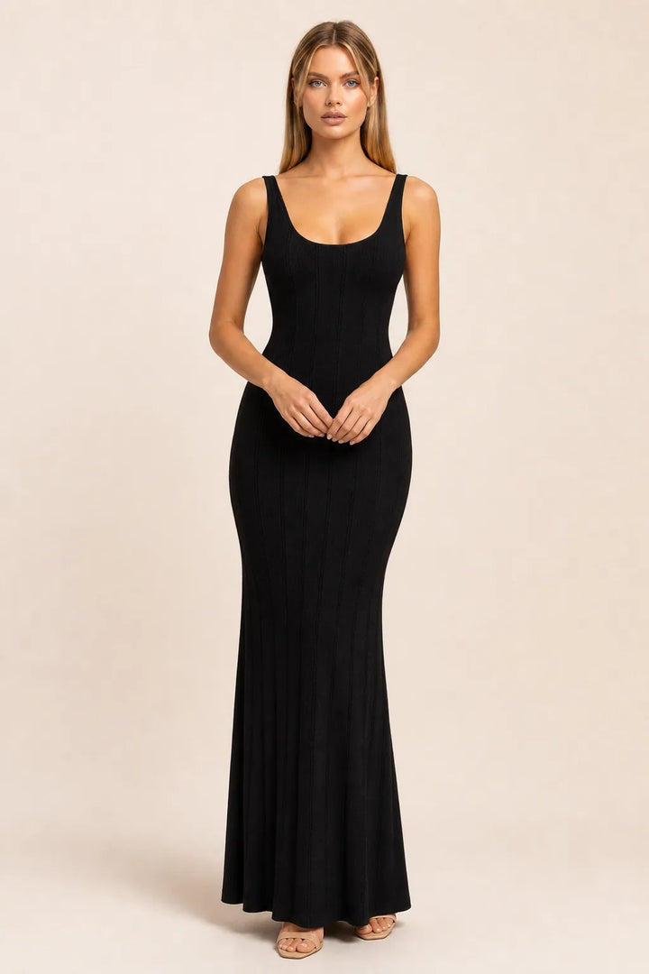 Black panelled knit maxi dress on model in contrapposto stance, full-length view