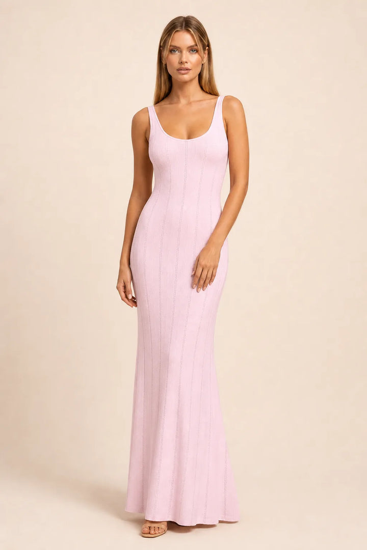 Pink panelled knit maxi dress on model in contrapposto stance, full-length view