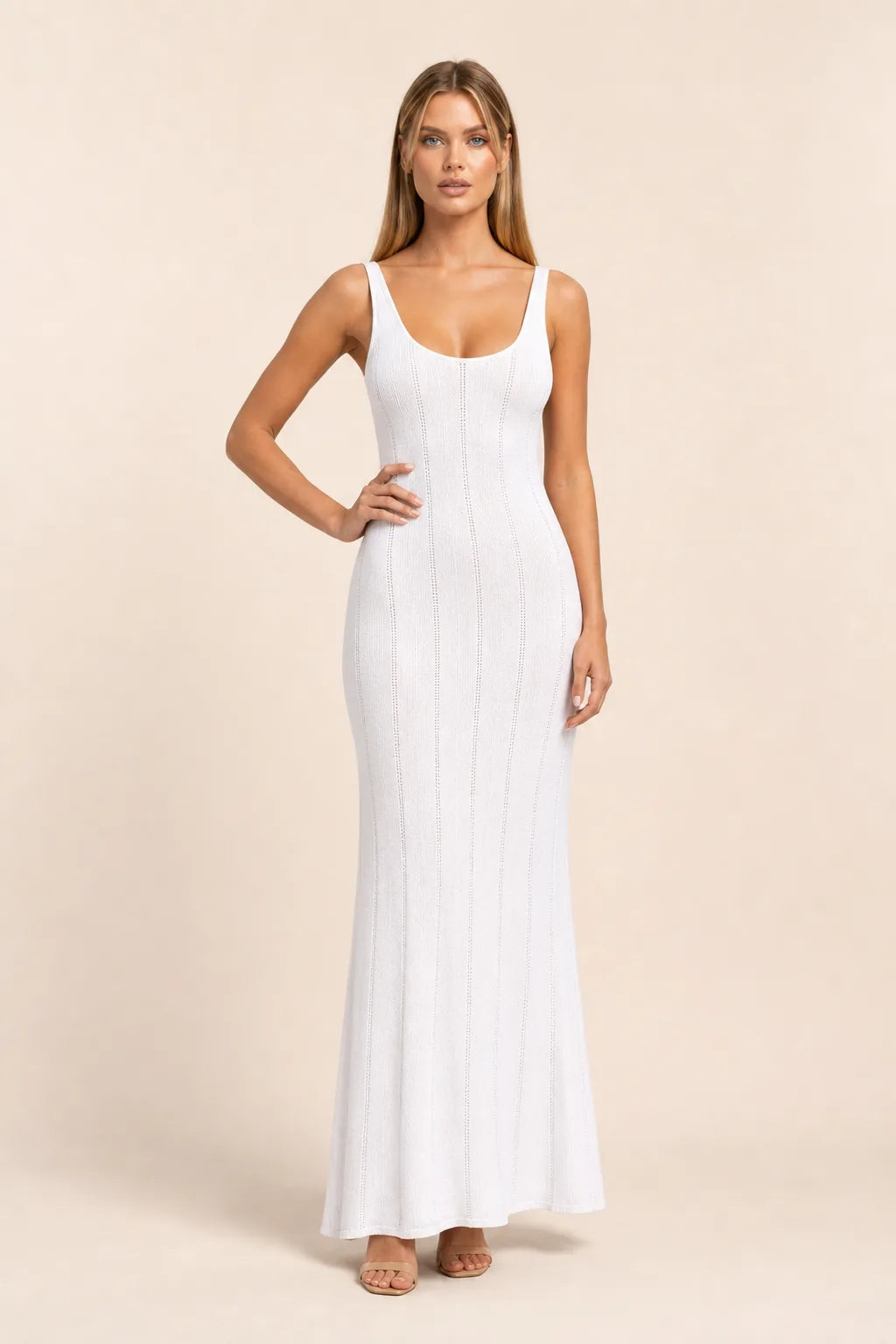 White panelled knit maxi dress on model in contrapposto stance, full-length view