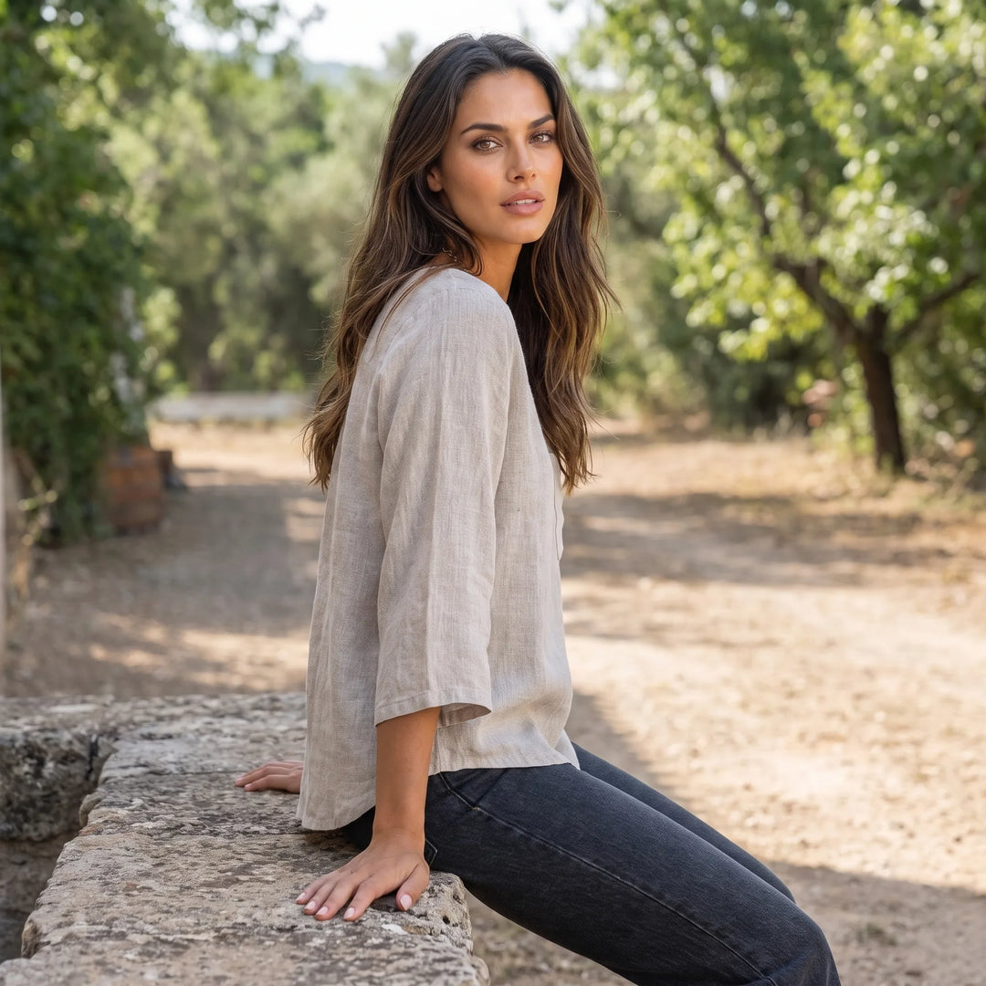 Model wearing a relaxed apricot pocket top in an outdoor lifestyle setting