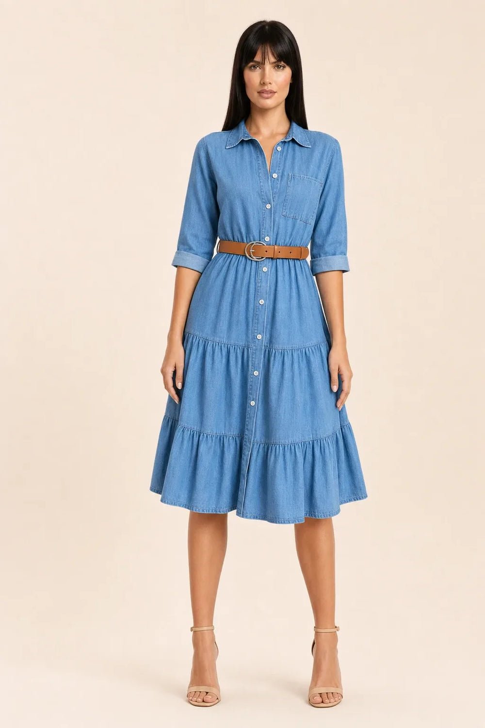 Tiered denim shirt dress in blue, model standing in contrapposto pose