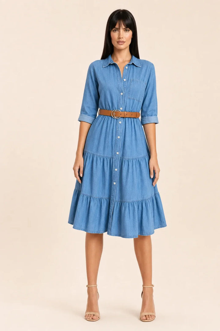 Tiered denim shirt dress in blue, model standing in contrapposto pose