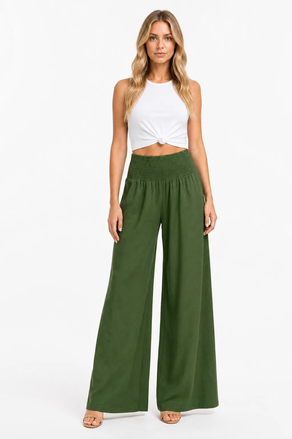 Army green smocked wide-leg pants on a model in a contrapposto stance