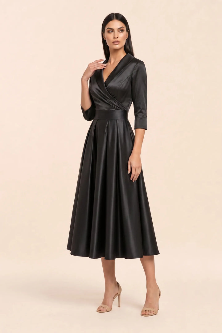 Black pleated satin midi skirt on a model in a three-quarter turn
