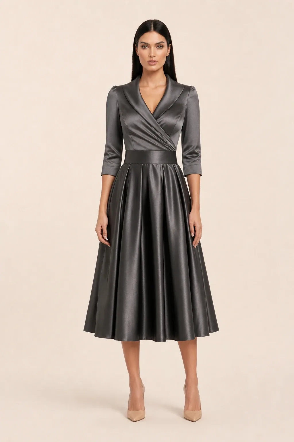 Gray pleated satin midi skirt on a model in a contrapposto stance