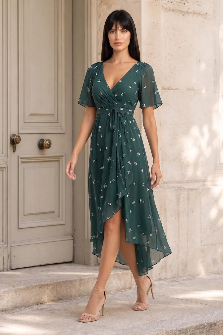 Green floral wrap midi dress on model in three-quarter turn