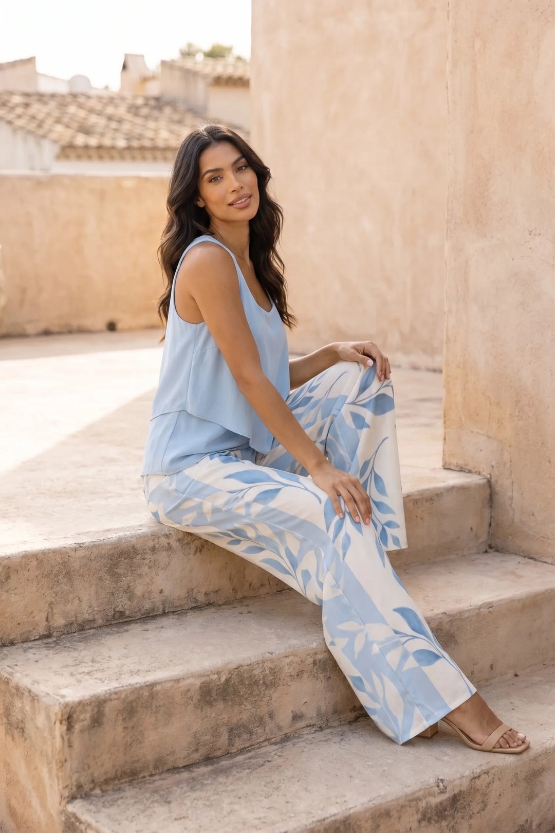 Model wearing blue layered trouser set in second lifestyle setting