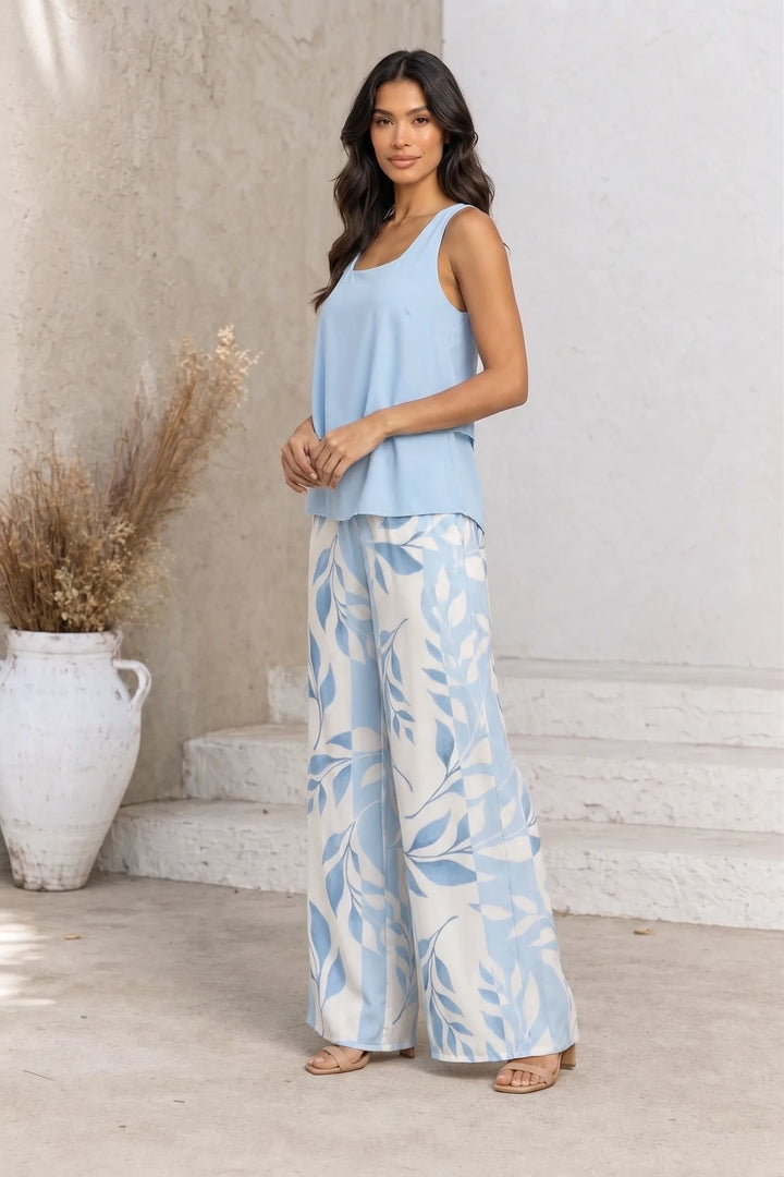 Blue layered trouser set on model in three-quarter turn