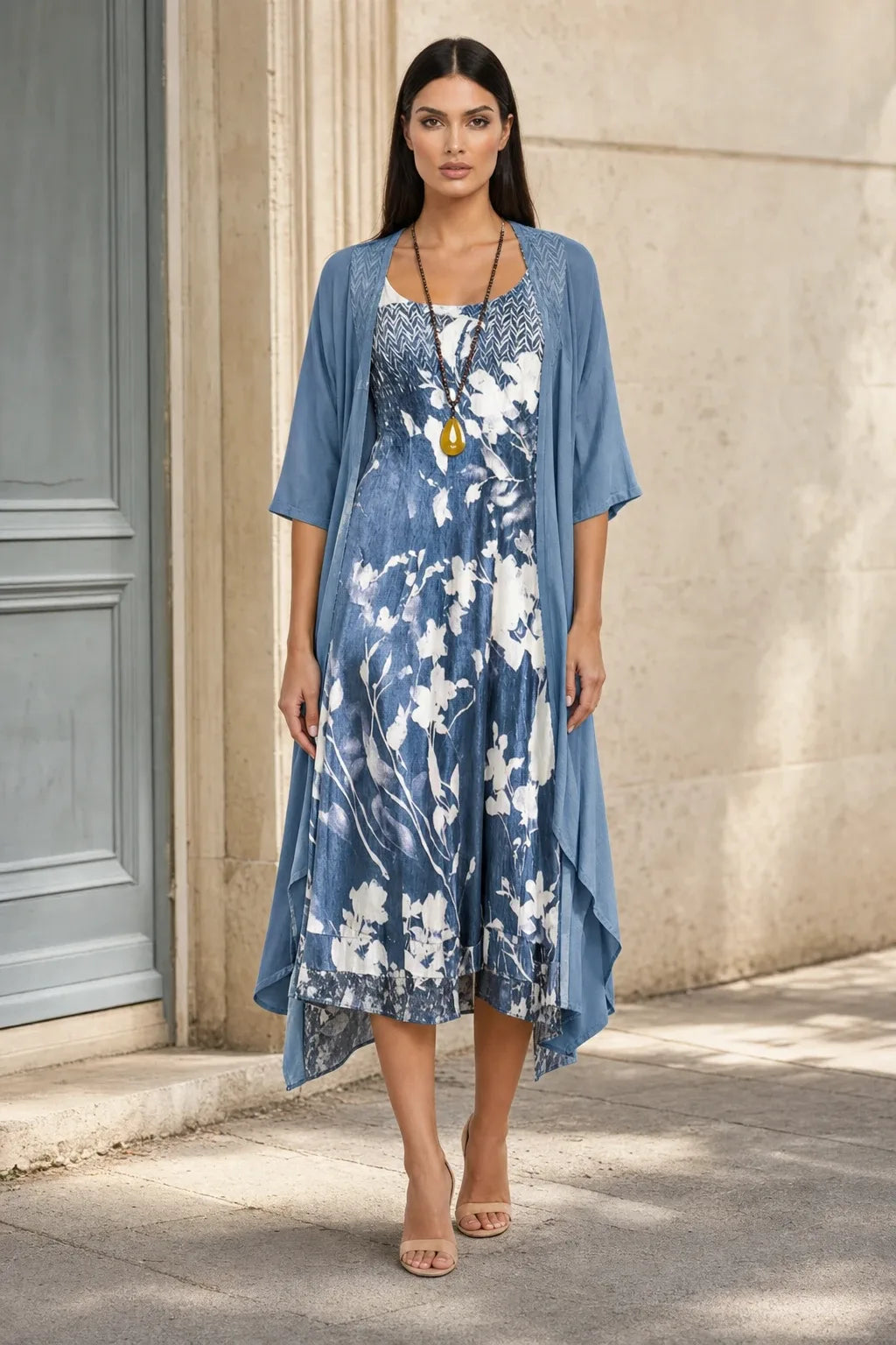 Blue floral two-piece midi set on model in contrapposto stance