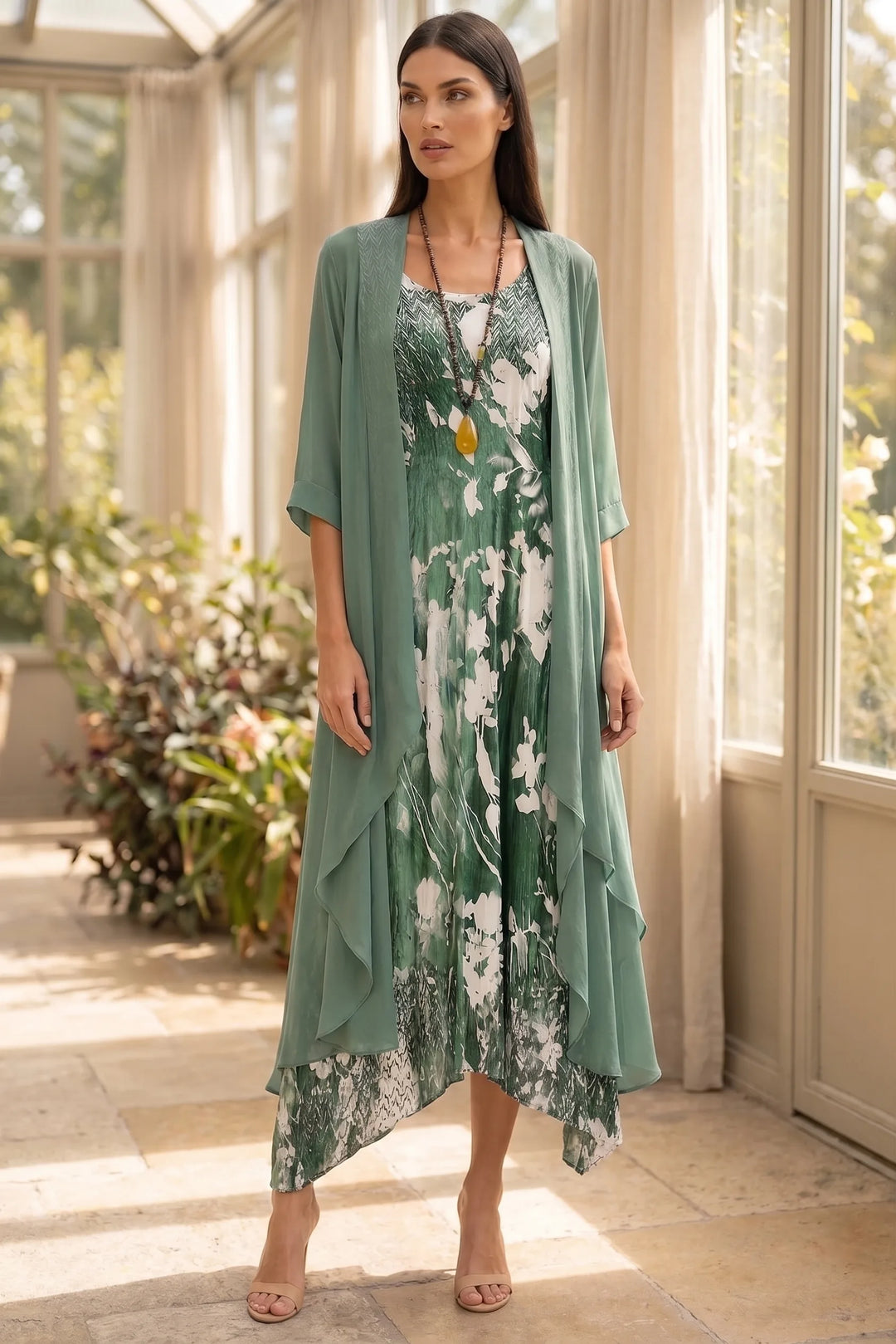 Model wearing green floral two-piece midi set in lifestyle setting