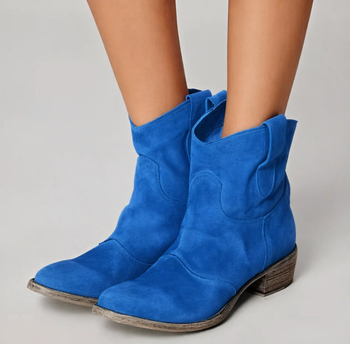 Blue western ankle boot, close-up detail of decorative stitching and pull tabs