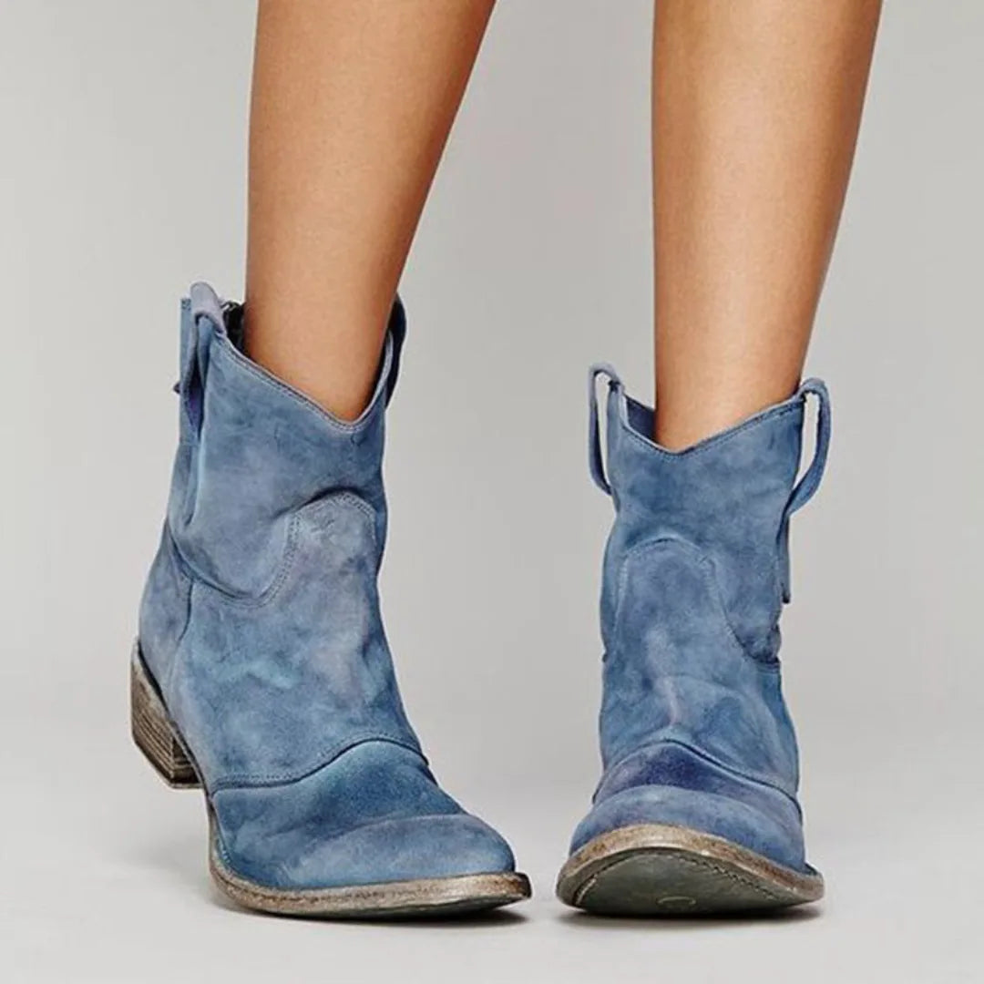 Light blue western ankle boot, heel view displaying back seam and block heel