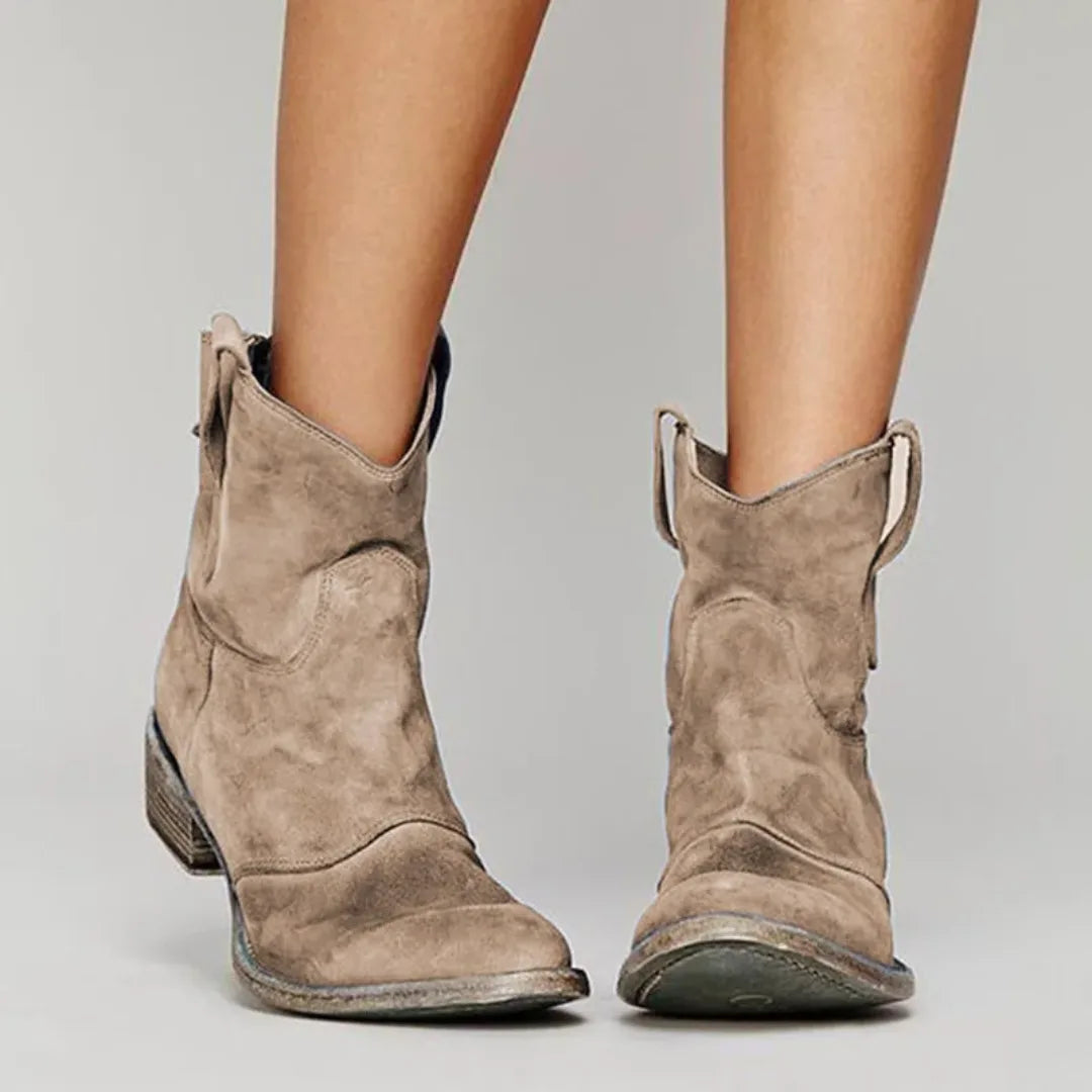 Light brown western ankle boot, front view showing toe and shaft stitching details
