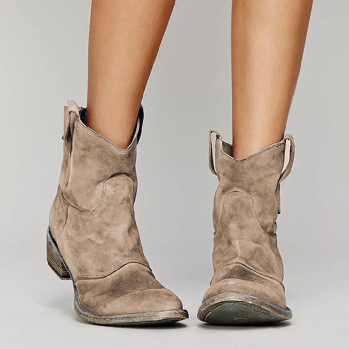 Light brown western ankle boot, front view showing toe and shaft stitching details